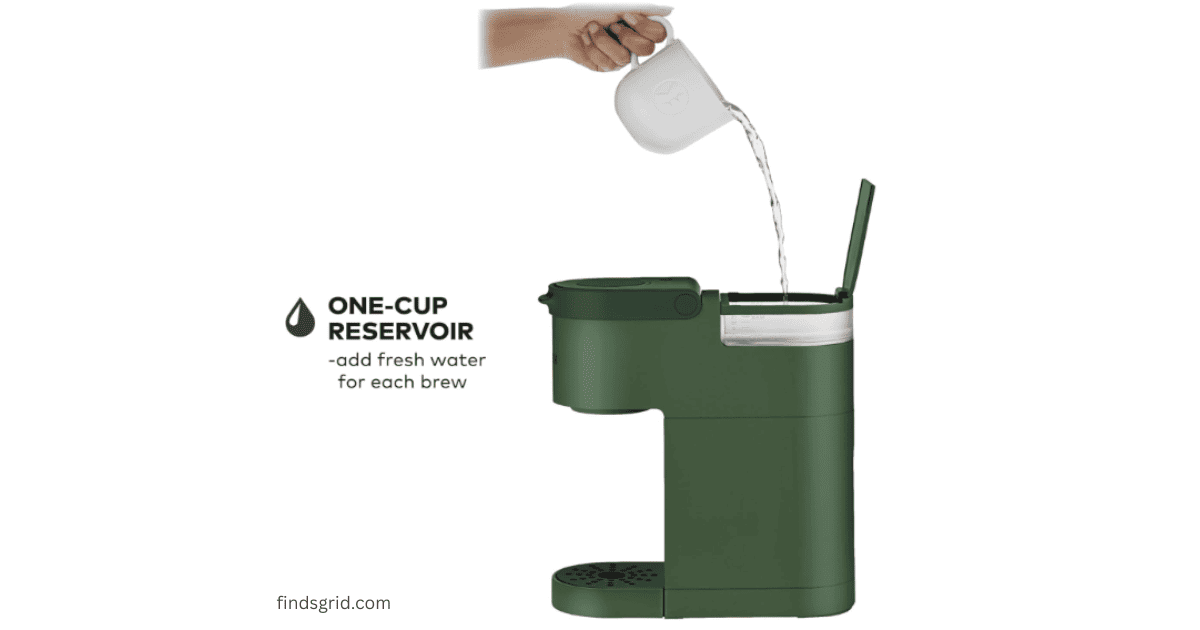 Pouring water into the one cup reservoir of a minimalist green coffee machine