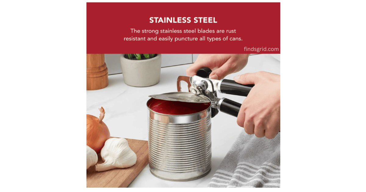 Close up of KitchenAid can opener stainless steel cutting wheel slicing through a metal can lid smoothly.