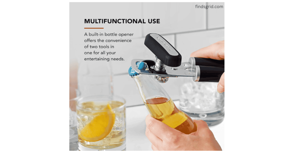 KitchenAid can opener being used as a bottle opener to remove a cap from a glass bottle.