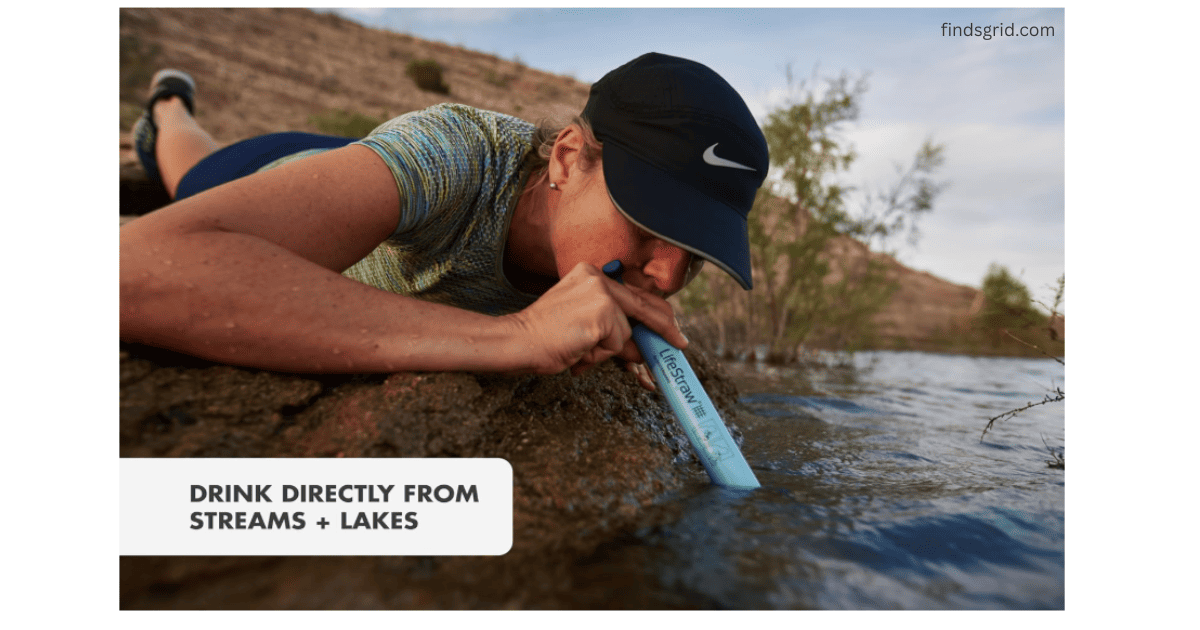 Woman hiker drinking directly from lake using LifeStraw filter