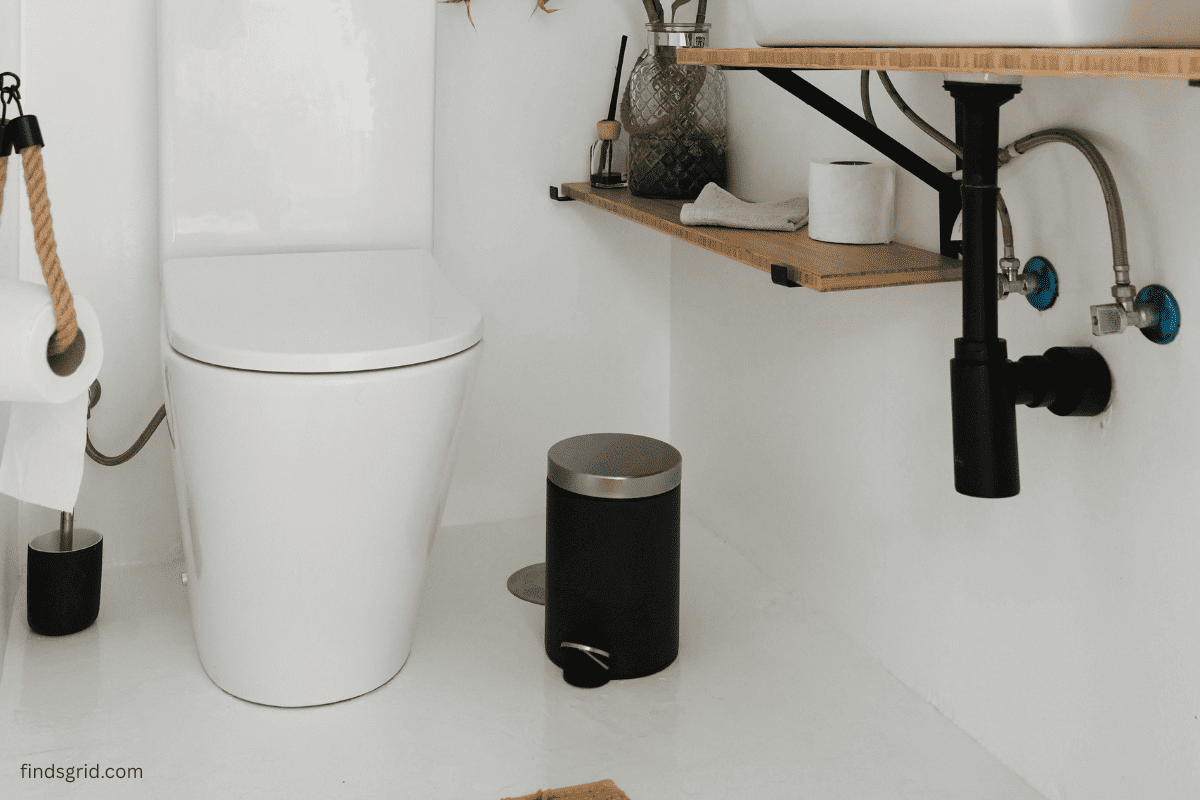 touchless vs foot pedal trash can comparison in small bathroom