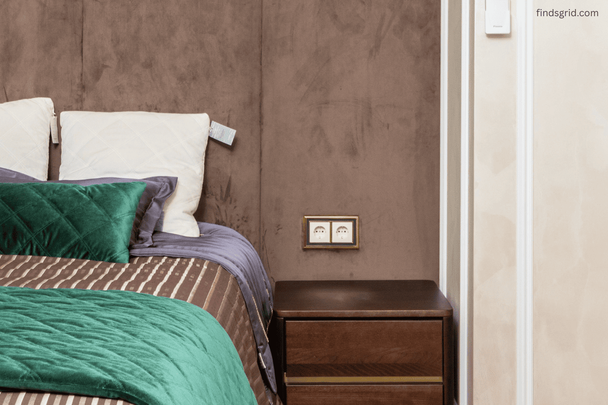 Dorm room bedside charging station setup with floating shelf and outlet extender