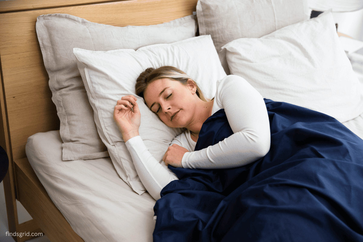 Side sleeper resting on a pillow, a look at sleep headphones vs earbuds for ear comfort