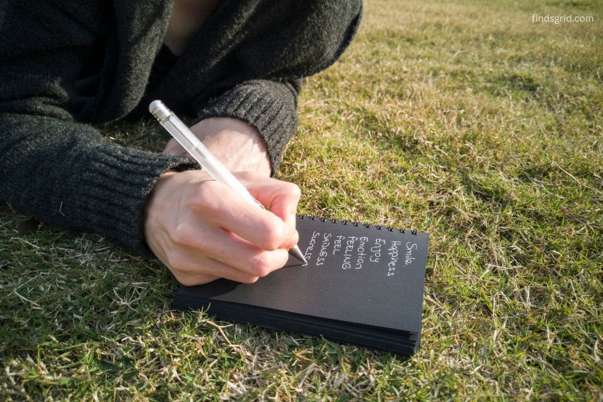 Phone and field notebook used to log nature photos with location notes