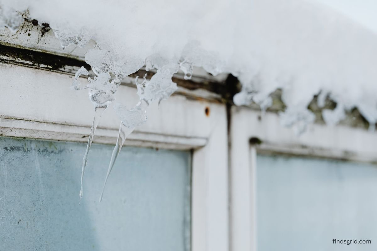 Clear plastic insulation film stretched over a window frame to block cold drafts
