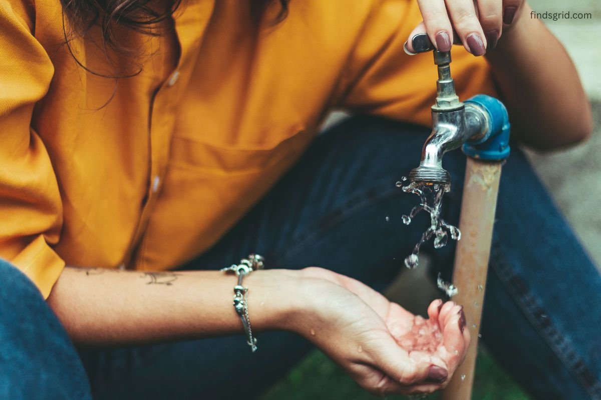 Outdoor faucet with frost on the spigot in freezing winter weather